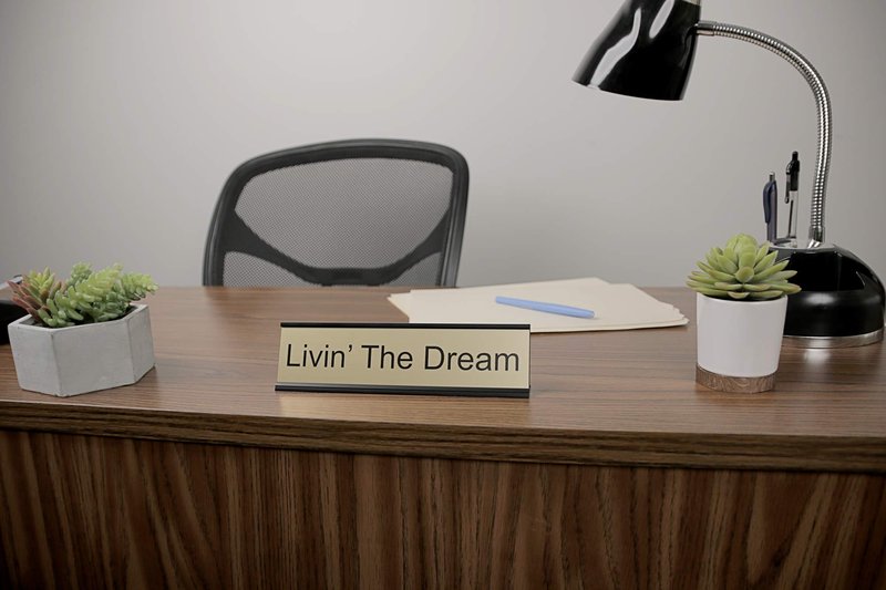 ExcelMark Livin' The Dream Desk Plate – 2"x 8"Novelty Name Plate – Gold Name Plate with Black Desk Holder