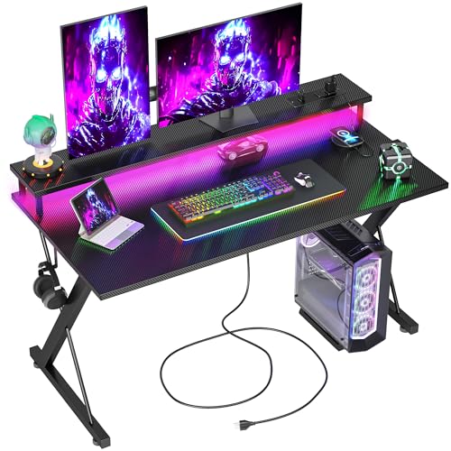 TIQLAB Gaming Desk with Power Outlets & LED 32 Inch Ergonomic Computer Carbon Fiber Surface Gamer Desk, Large Monitor Stand, Headphone Hook, PC Workstation for Bedroom, Black