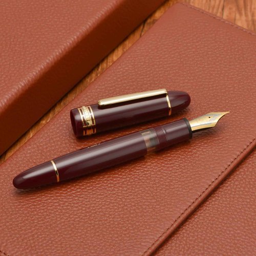 Yongsheng Junlai 630 Acrylic Fountain Pen, Size 8 Medium Nib with Piston Filling System, Wine Red Transparent Ink Tank with Torpedo Shape Design Smooth Writing Pen (Gold Trim)